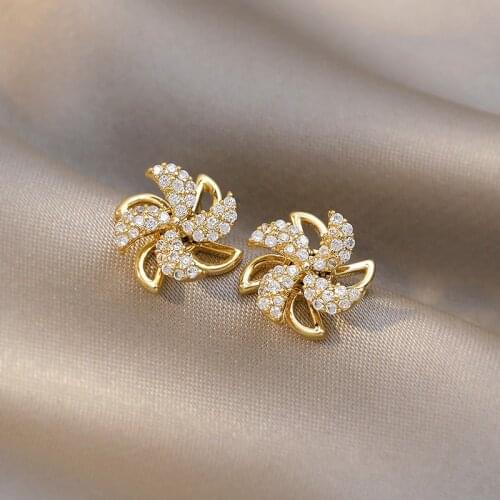 S925 silver needle can rotate the windmill earrings temperament female network red South Korean earrings new tide earrings