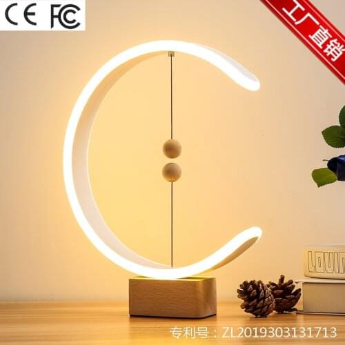 Magnetic suspension balance light absorption trill with web celebrity gift desk lamp marriage room of the head of a bed