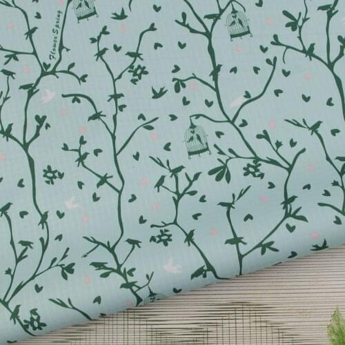 WF065 - PVC coated waterproof fabric - Branches and birds on Light Blue bakcground