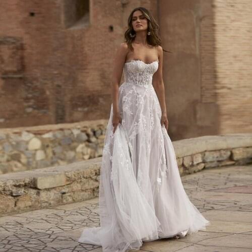 Champagne Pink Boho Wedding Dresses 2021 Lace Appliques Illusion Princess Beach A-Line Bridal Gowns With Long Sleeves