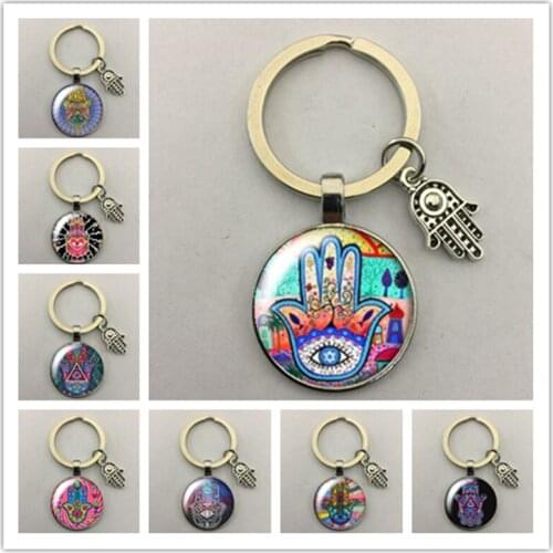 Hot sale devil hand pattern round glass cabochon keychain car keychain keychain small jewelry gift keychain