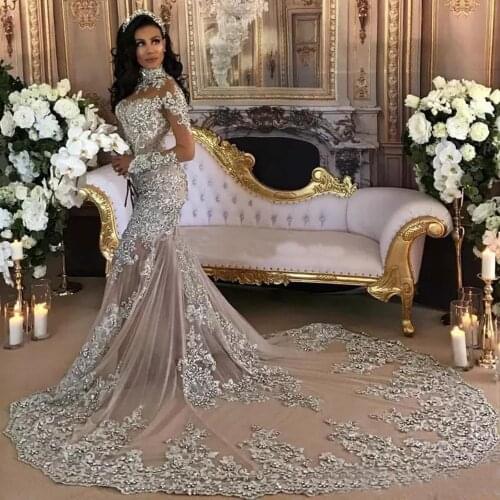 Dubai Arabic Luxury Sparkly 2020 Wedding Dresses Sexy Bling Beaded Lace Applique High Neck Illusion Long Sleeves Mermaid Dress