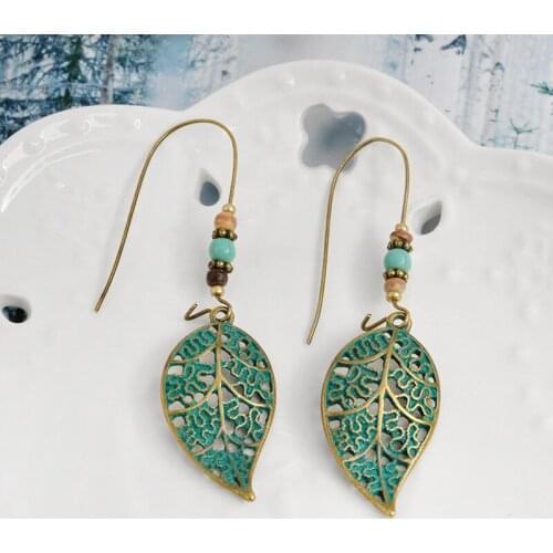 Fashion Hollow Metal Leaves Small Beads Dangle Earrings For Women Girls New Bohemian Elegant Style Drop Earrings Charm Hot Sale