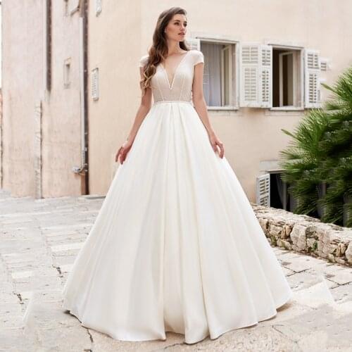 UZN Elegant Ivory Illusion V-Neck Wedding Dress Cap Sleeves Bridal Gown With Glitter Tulle Sexy Backless Beading Brides Dresses
