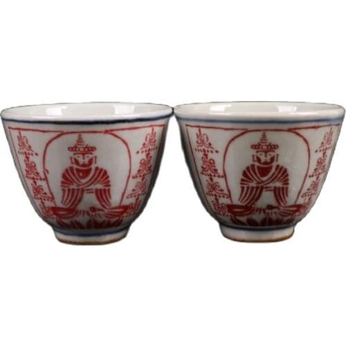 A pair of Chinese Jingdezhen ceramic cups with blue and white glaze and red figure pattern