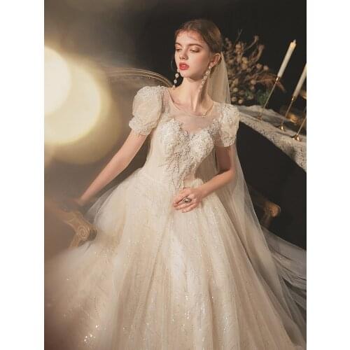 Luxury Champagne Wedding Dresses O-Neck Puff Sleeve A-line Sequins Shining Lace Beaded Princess Arabian Elegance Bridal Gowns