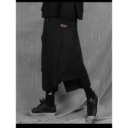 Spring and autumn mens new solid color elastic waist irregular asymmetrical cut wide leg trousers nine - minute skirt