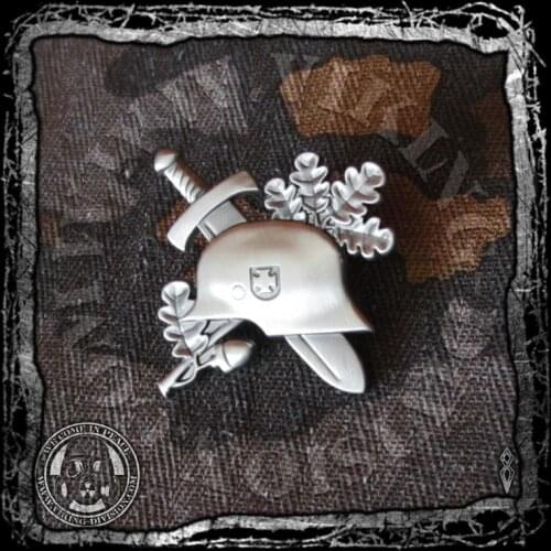 German helmet crossed dagger and oak leaves pin badge