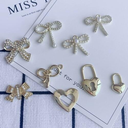 Trend Sweet Alloy Inlaid Pearl Diamond Bowknot Pendant Wedding Love Lock Pendant Party Earrings Necklace Material Wholesale