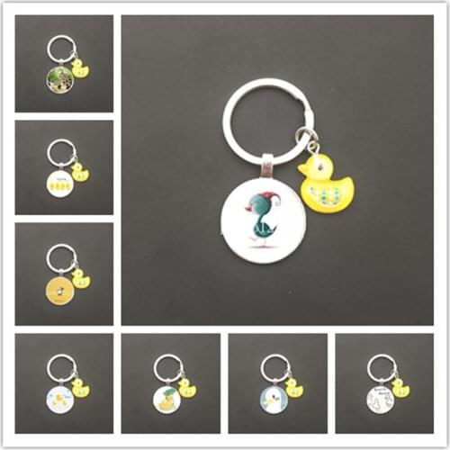 2021 new hot sale duckling keychain small yellow duck glass cabochon keychain car bag pendant love duck small gift