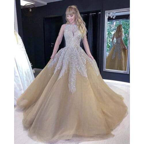 Luxury Wedding Dresses O Neck Beaded Stones Heailvy Sheer Long Sleeve Ball Gown Champagne Bridal Gown