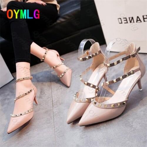 Baotou rivet sandals 2021 new summer high heels versatile fashion pointed mid-heel Roman thick heel womens shoes heels women