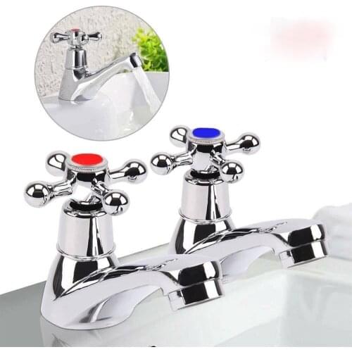 Double faucet chrome-plated hot and cold water faucet system in traditional bathroom