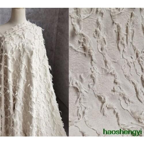 High-quality beige jacquard tassel irregular linen cut cloth creative fashion fabric