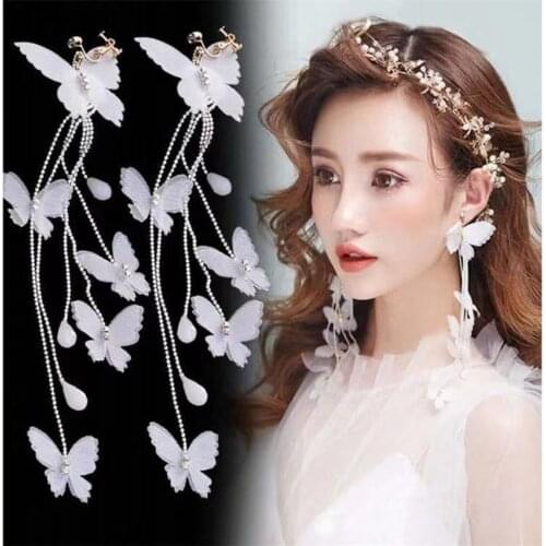 Butterfly studs Korean fashion wild tassel white flower butterfly rice beads handmade personality female earrings 608