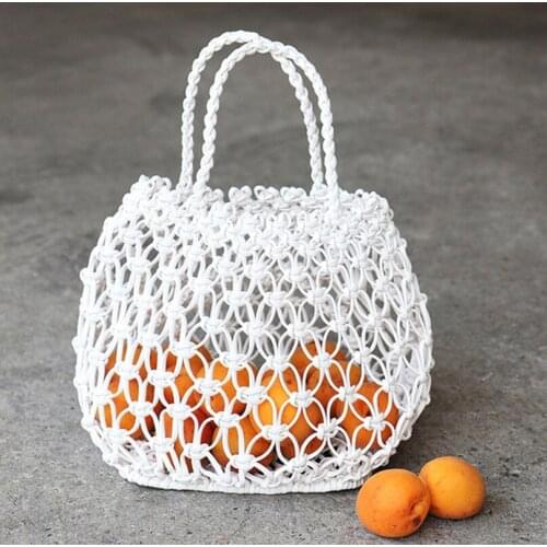 2020 new copper coin buckle handmade PU woven bag hand grid cutout straw bag casual woven bag