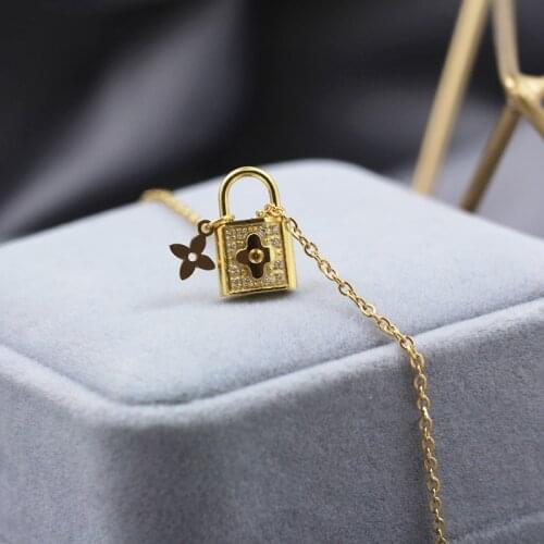 Delicate Flower Embossed Lock Pendant 18K Gold Plated Necklace Female Stainless Steel Chain Bracelets Womens Jewelry Lock 2021