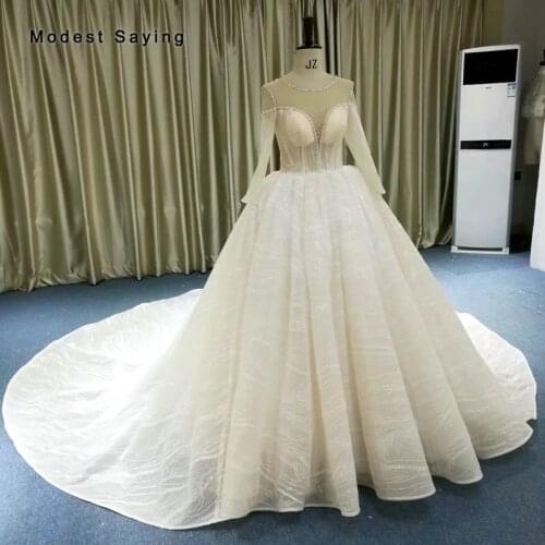 Luxury Monarch Ball Gown Shiny Sparkle Beaded Wedding Dresses 2019 with Cathedral Train Sexy Sheer Long Sleeves Bridal Gowns