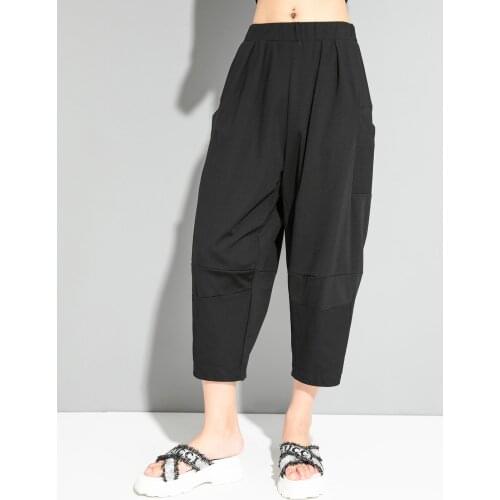 European and American summer thin loose Harem Pants dark black street personality stitching pocket show thin cocoon type Capris