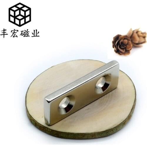 F40 * 15*5-5-5 large quantity strong magnetic screw hole magnet iron absorbing stone 40*15*5 double hole 5