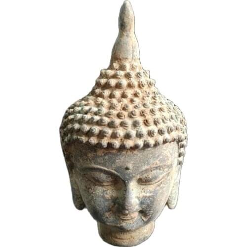 Antique Buddha head ornaments unearthed from bronze ware