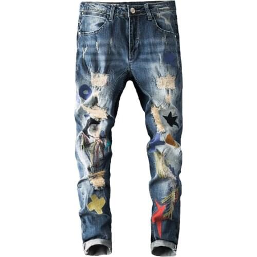 New trousers Spring summer Europe retro personality embroidery jeans mens male slim casual youth ripped beggar pants trousers
