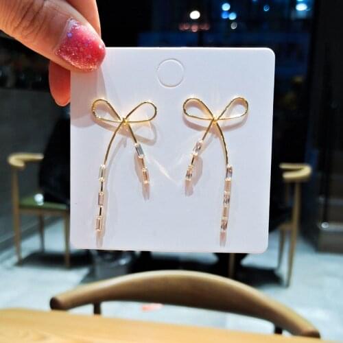 Girly bowknot earrings female simple Korean version of super fairy earrings beautiful temperament age-reducing earrings