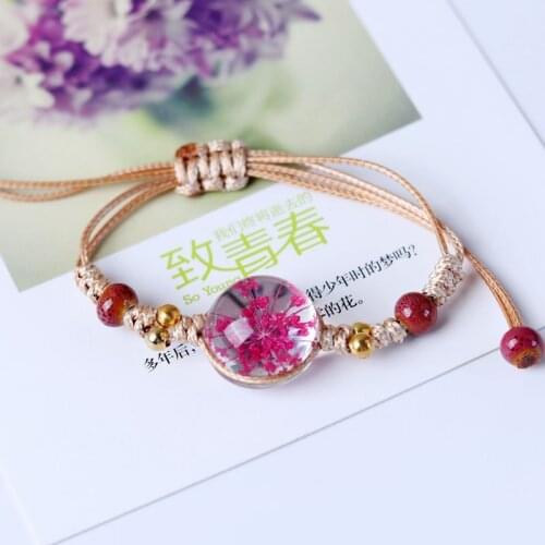 Japanese and Korean romantic dried flower transparent crystal ceramic nylon rope knotted ladies bracelet, symbol of happiness
