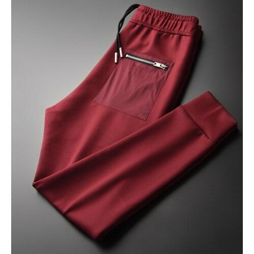 New Red Mens Pants Luxury Zipper Pockets Solid Color Casual Sports Man Pants Autumn And Winter Slim Fit Man Trousers 4XL