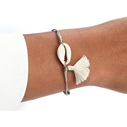The new casual joker shell tassel bracelet Europe and America simple fashion metal round bead cotton rope woven bracelet anklets