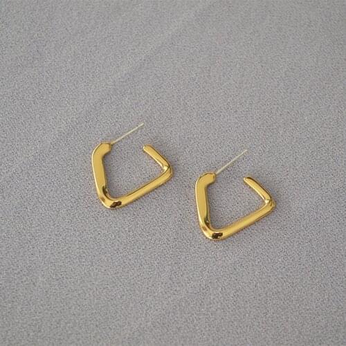 Korean version triangular twisted brass niche cold temperament earrings