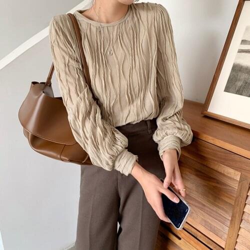 2021 spring new Korean minority design lace fold round neck loose straight shoulder pad blouse 2021-02-28