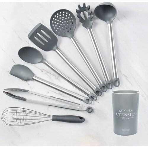 The new silicone kitchen utensils and European titanium spatula multicolor receive a bucket of high temperature resistant suit