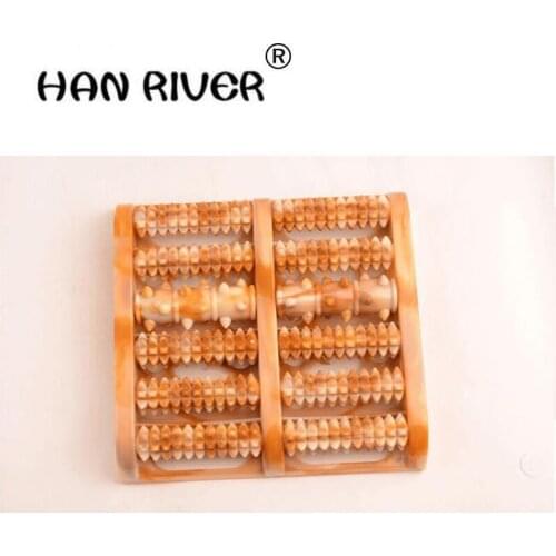A foot massage roller foot massage acupuncture points to rub feet meridians pedicures wooden foot massage