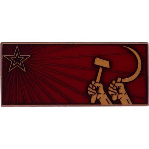 Soviet red propaganda poster badge of the Cold War raised in the air fist sickle and the star of communism