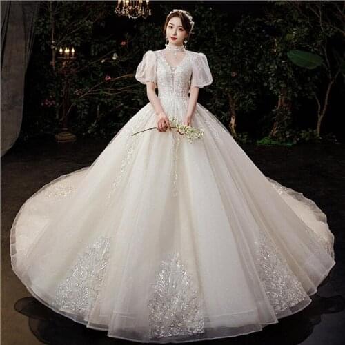 Luxury V Neck Short Sleeves Wedding Dresses 2021 Sparkly Beads Lace Champagne Princess Ball Gown RoYal Train Vestido De Novia