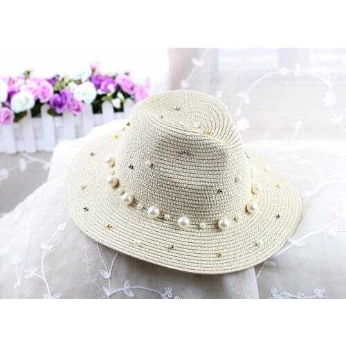 Korean version of the knit hat visor ladies England black straw hat big hat summer fashion trend with beads hat