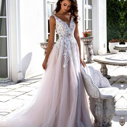 Tulle V Neck A-line Wedding Dresses Sexy Backless Lace Appliques Bridal Gown Sleeveless Robe De Mariage Wedding Gown 2021