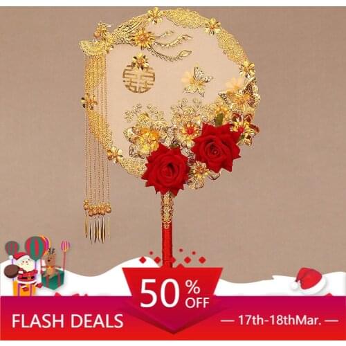 Chinese bride covers her face and holds flowers in her hand. Ancient style wedding, wedding, group fan, wedding luxury hand fan