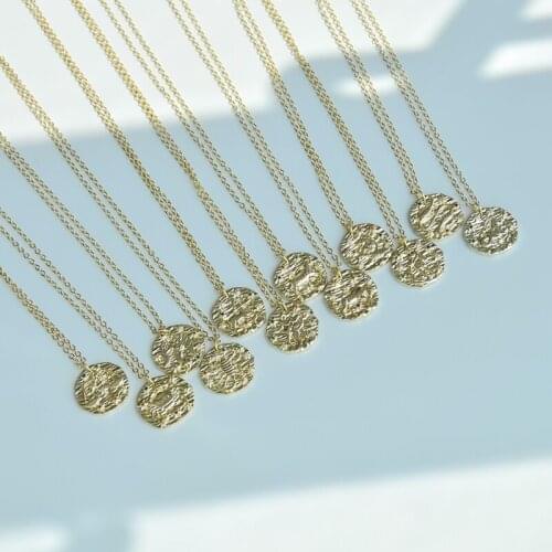 Twelve constellation relief irregular round pendants inlaid with zircon gold copper necklace can pull the cross necklace