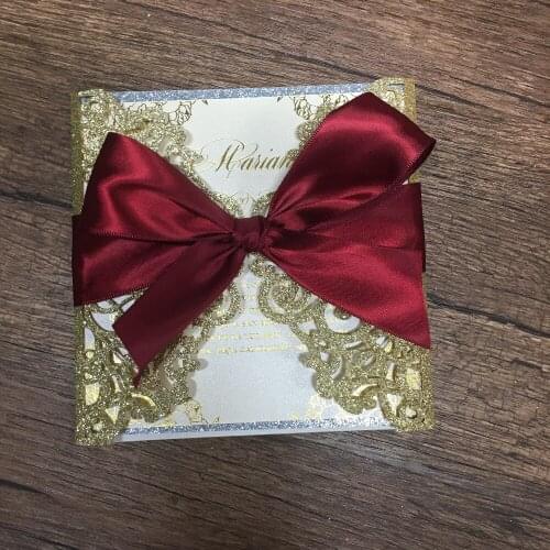 Hot sell glitter gold and silver wedding invitation card with ribbon bow laser cutting lace wedding favor invitations price