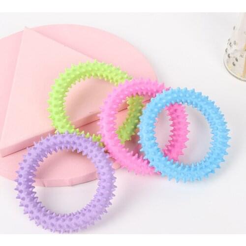 Pet dog toy TPR plastic bone piercing ring floating toy molar teeth cleaning anti bite interactive toy