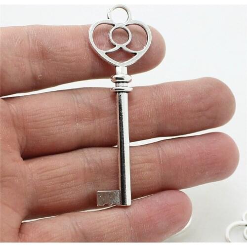 Sweet Bell Wholesale 20pcs 19*60mm Antique Metal Zinc Alloy Trendy Hollow Lovely Key Jewelry Pendant Charms D0944