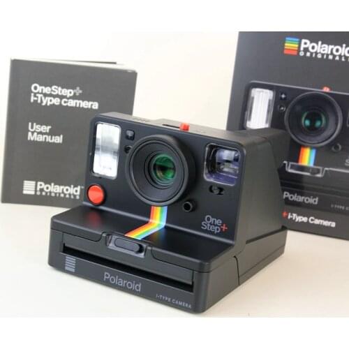 Polaroid Originals Onestep+ White and Black rainbow camera with i-type 600 film and Bluetooth is connected to the phone