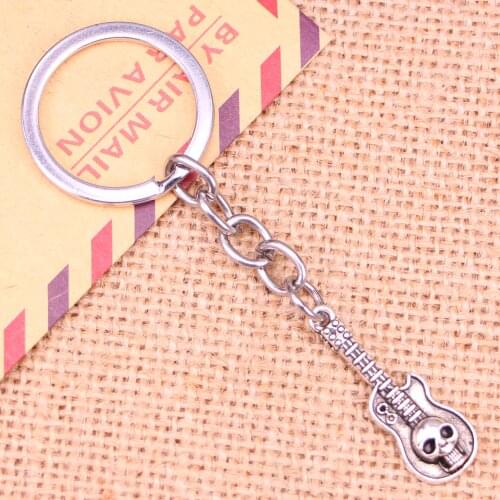 20pcs New Fashion Keychain 32x11mm guitar skull Pendants DIY Men Jewelry Car Key Chain Ring Holder Souvenir For Gift