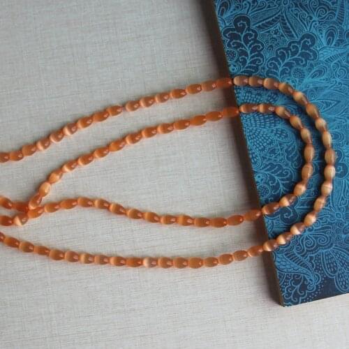 About 5x7mm cats eye glass rice beads,1.0mm in hole size,About 57 pieces per lot,Wholesale price