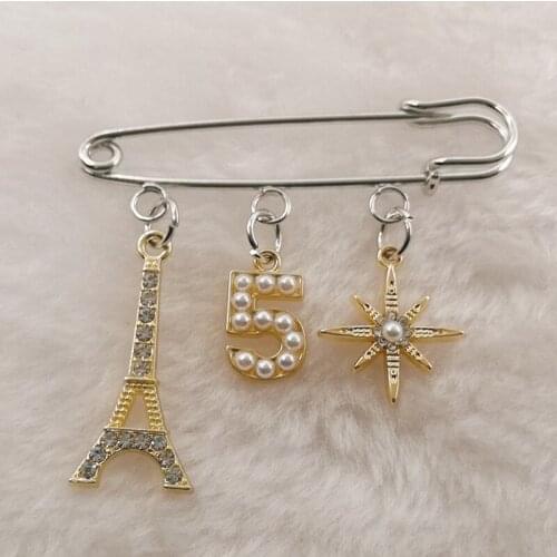 European fashion lucky numbers 0,1,2,3,4,5,6,7,8,9 Eiffel Tower, seven-pointed star exquisite brooch