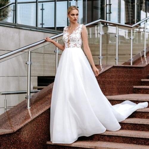 Elegant Lace Appliques Wedding Dress 2021 A-line O-Neck Beads Bridal Gowns Simple Boho Button llusion Back Beach Robe De Mariee