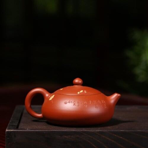 Yixing genuine teapot famous raw stone Zhu mud plum blossom teapot wholesale