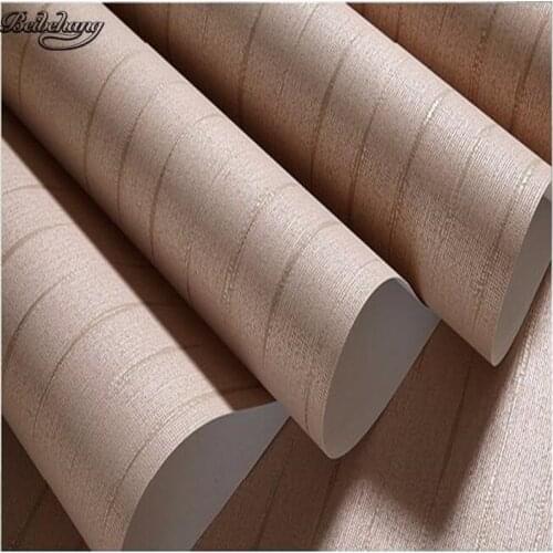 Beibehang Plain wallpapers modern non - woven wallpapers living room bedroom TV background straw color solid shop
